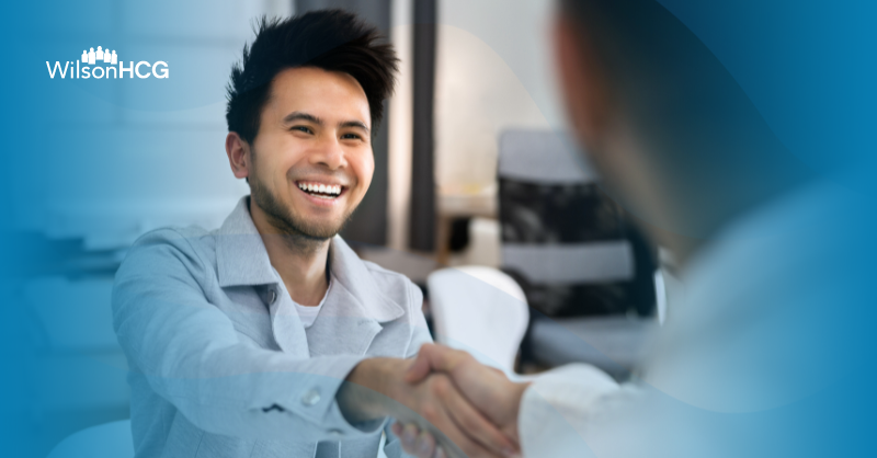 Man shaking hands with a skills-based hire