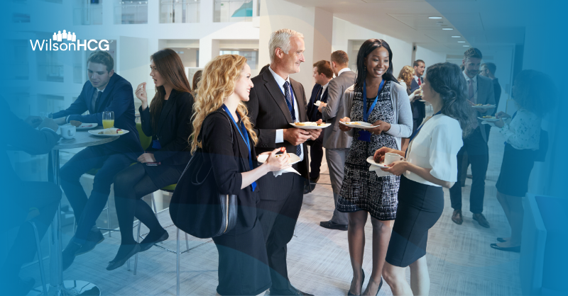 Business people networking at a conference.