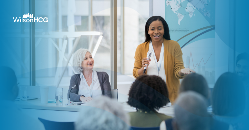 Female panelist speaking to a crowd.