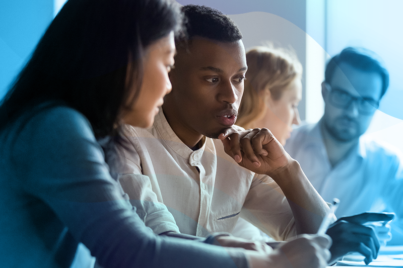 Group of employees looking at notes