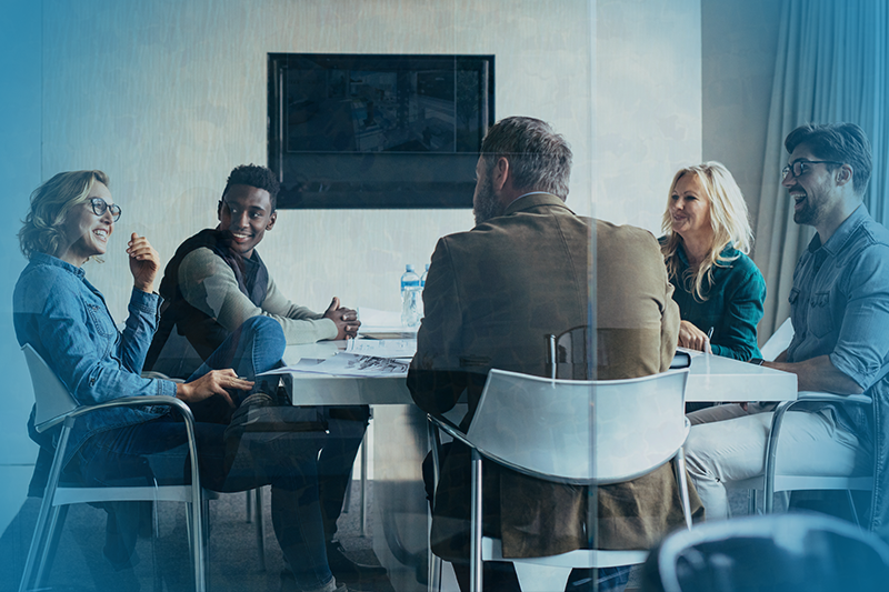 Group of employees together in a room