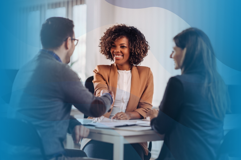 Two hiring managers at WilsonHCG interview a potential candidate.