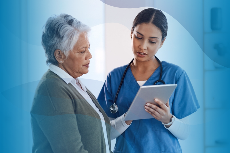 Latina nurse shows test results to mature patient.