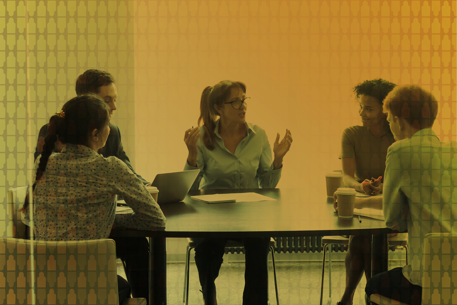 People talking around a table doing business