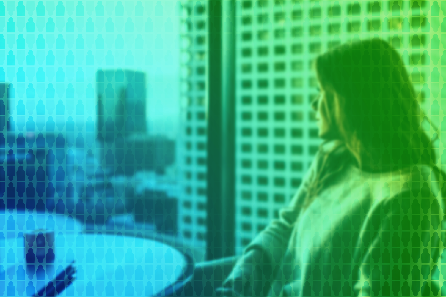 business woman deep in thought looking out window of office