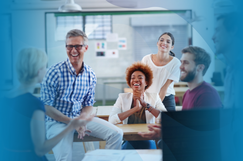 Employees in conference room happy at presenter for award