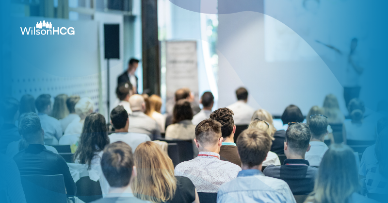 Crowd of people at a panel discussion for TALiNT Partners Foresight Summit 2024