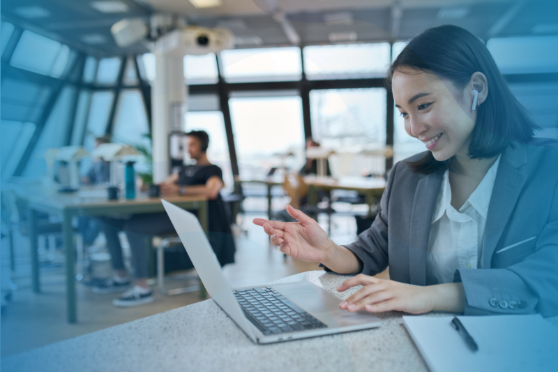 Employee based in the APAC office sitting with her laptop