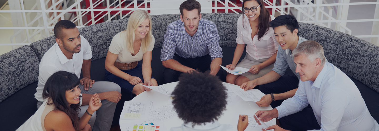 Group of diverse people sitting in circle discussing recruitment